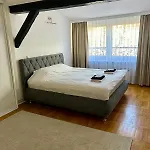 The Warmth Of A With A Fireplace In The Very Center Of